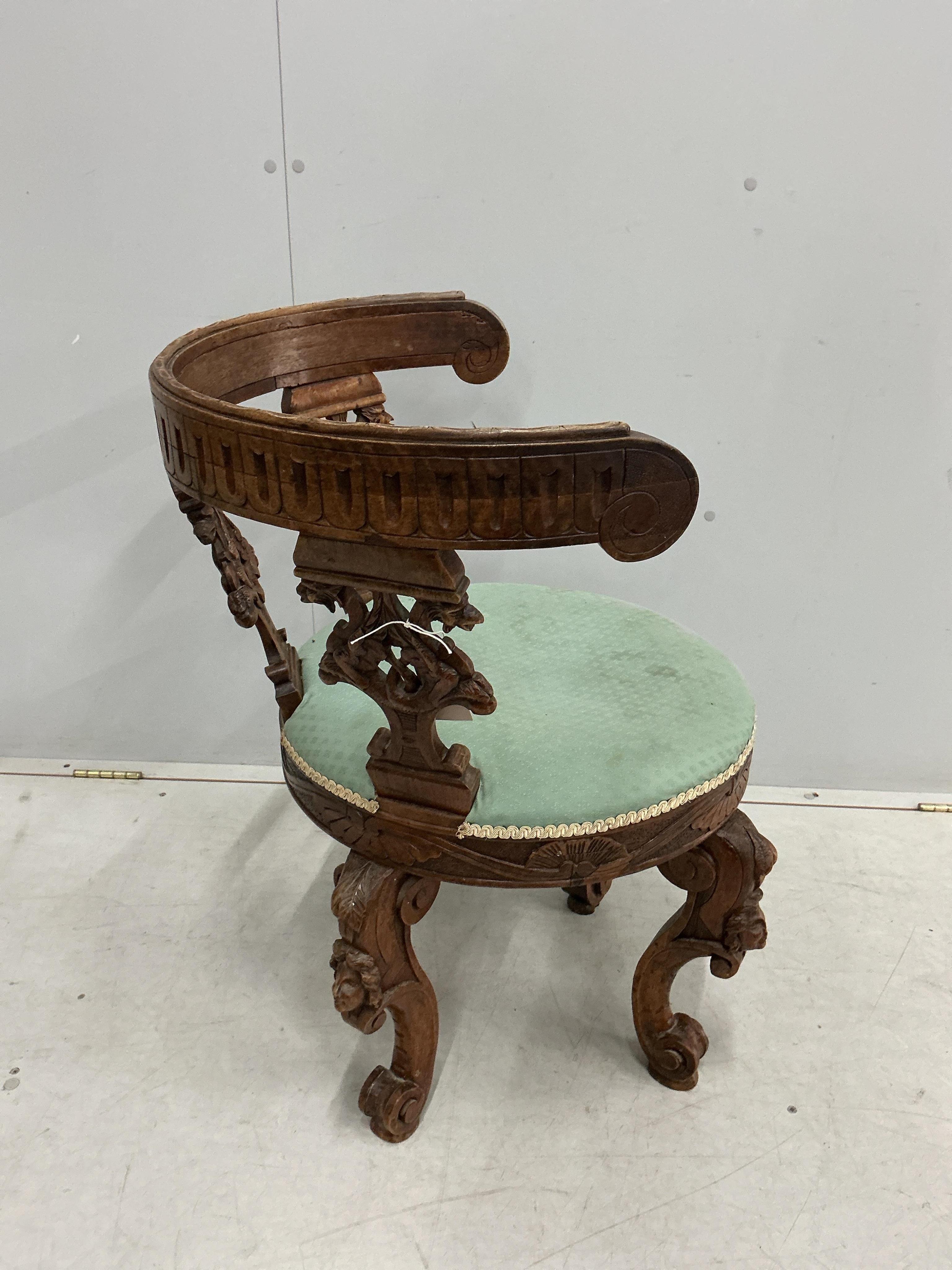 A late 19th century Italian carved walnut tub framed chair, width 61cm, depth 51cm, height 79cm